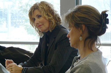 Two women sitting in a meeting